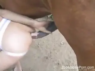 Horny female loves humping her twat with the horse dick