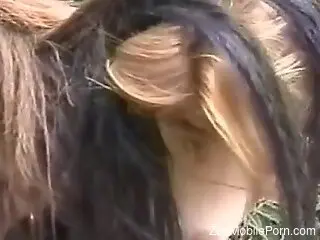 Blond slut starts having zoo sex with a horse