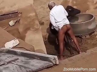 Ebony zoophile is caught having zoo sex outdoors