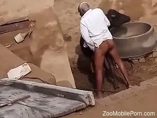 Ebony zoophile is caught having zoo sex outdoors